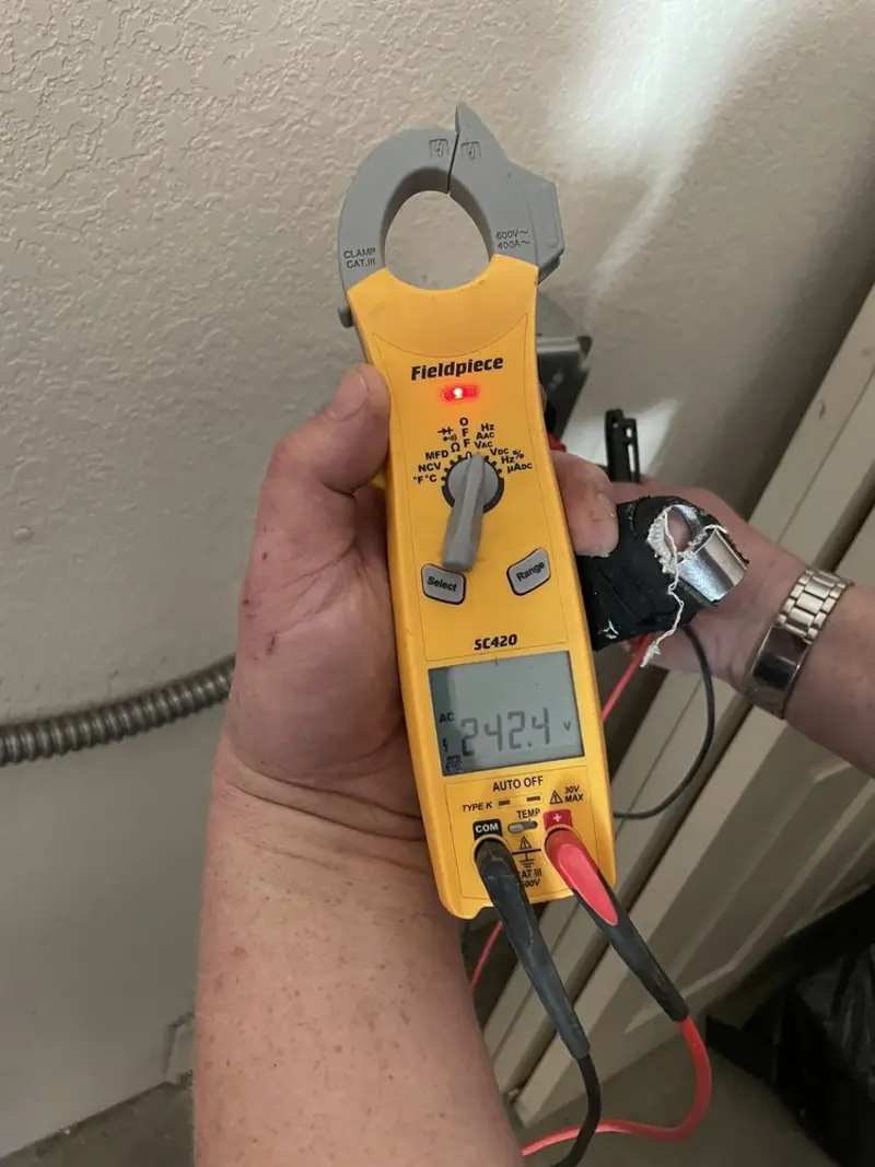Voltage testing with clamp meter during Hot Tub / Pool Electrical Wiring in Round Lake Park